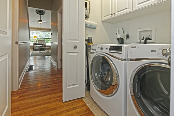 a view of a hallway with washer and dryer