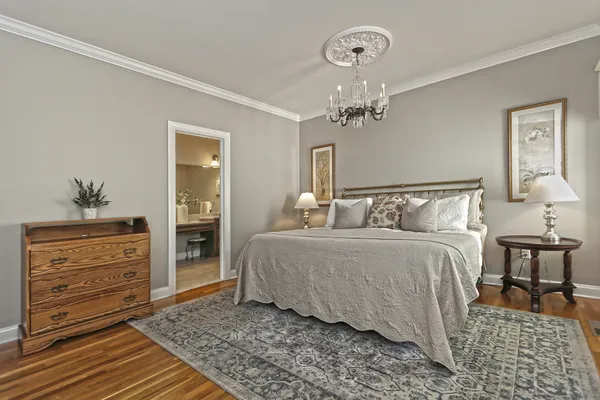 a bedroom with a bed and dresser