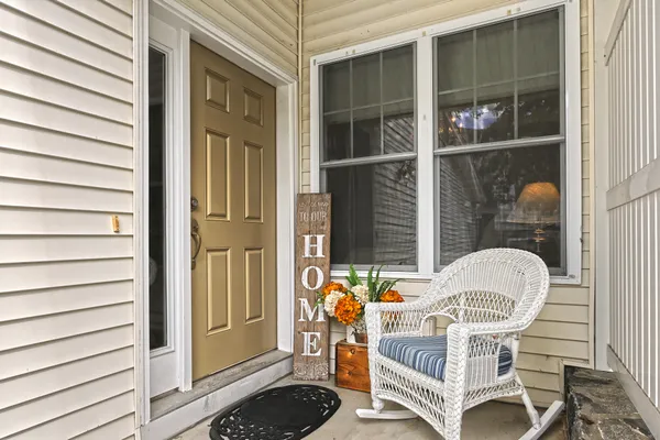 a view of balcony with two chairs and a table