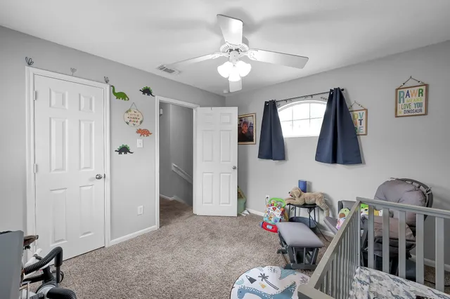 a view of a livingroom with furniture and bedroom wooden floor
