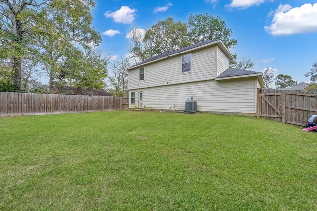 a view of a backyard with a small cabin