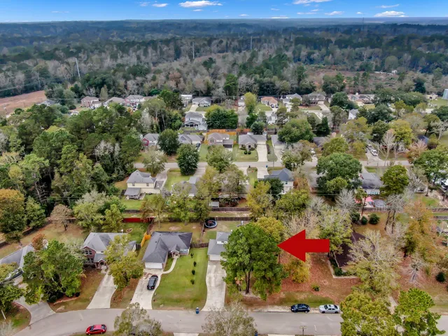 an aerial view of residential house with outdoor space