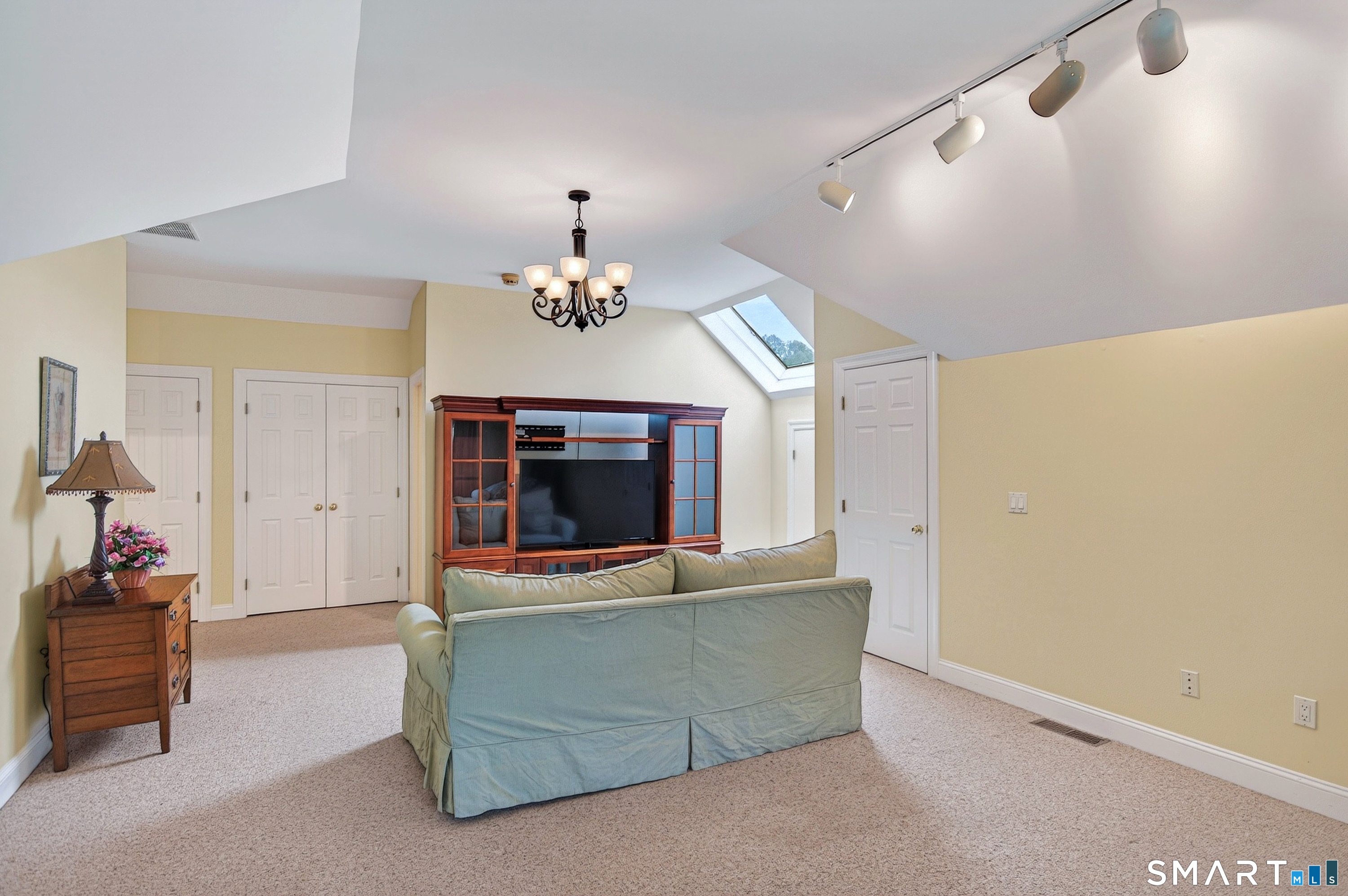 16 Farm Meadow Road Newtown, CT 06470 - Photo 15 of 40 Expansive upper-level retreat offering versatile living space, skylights, and abundant storage options.