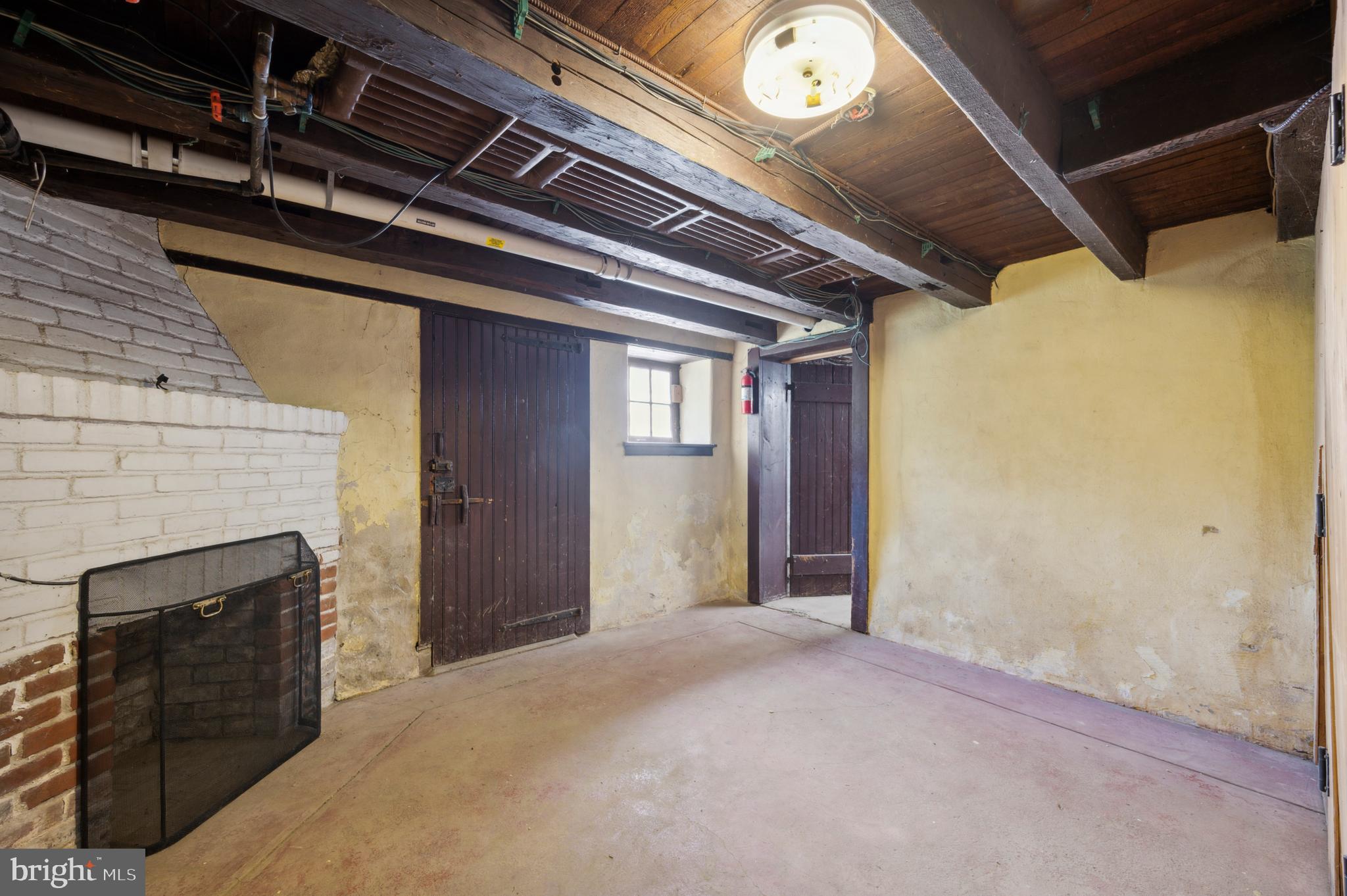 257 Barren Road Media, PA 19063 - Photo 33 of 52 Original basement room with fireplace