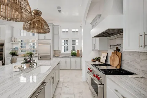 a kitchen with a sink stove and cabinets
