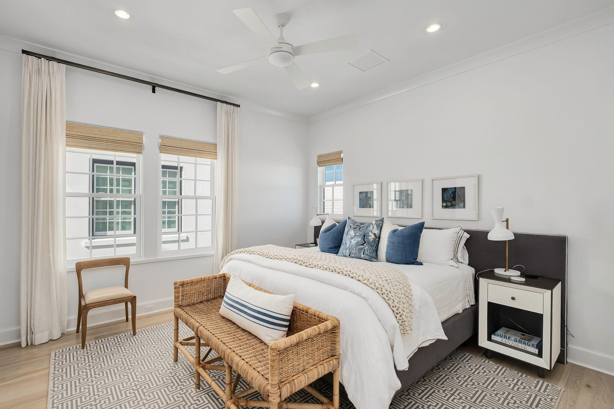 91 Whalebone Alley Inlet Beach, FL 32461 - Photo 15 of 17 a spacious bedroom with a bed and wooden floor