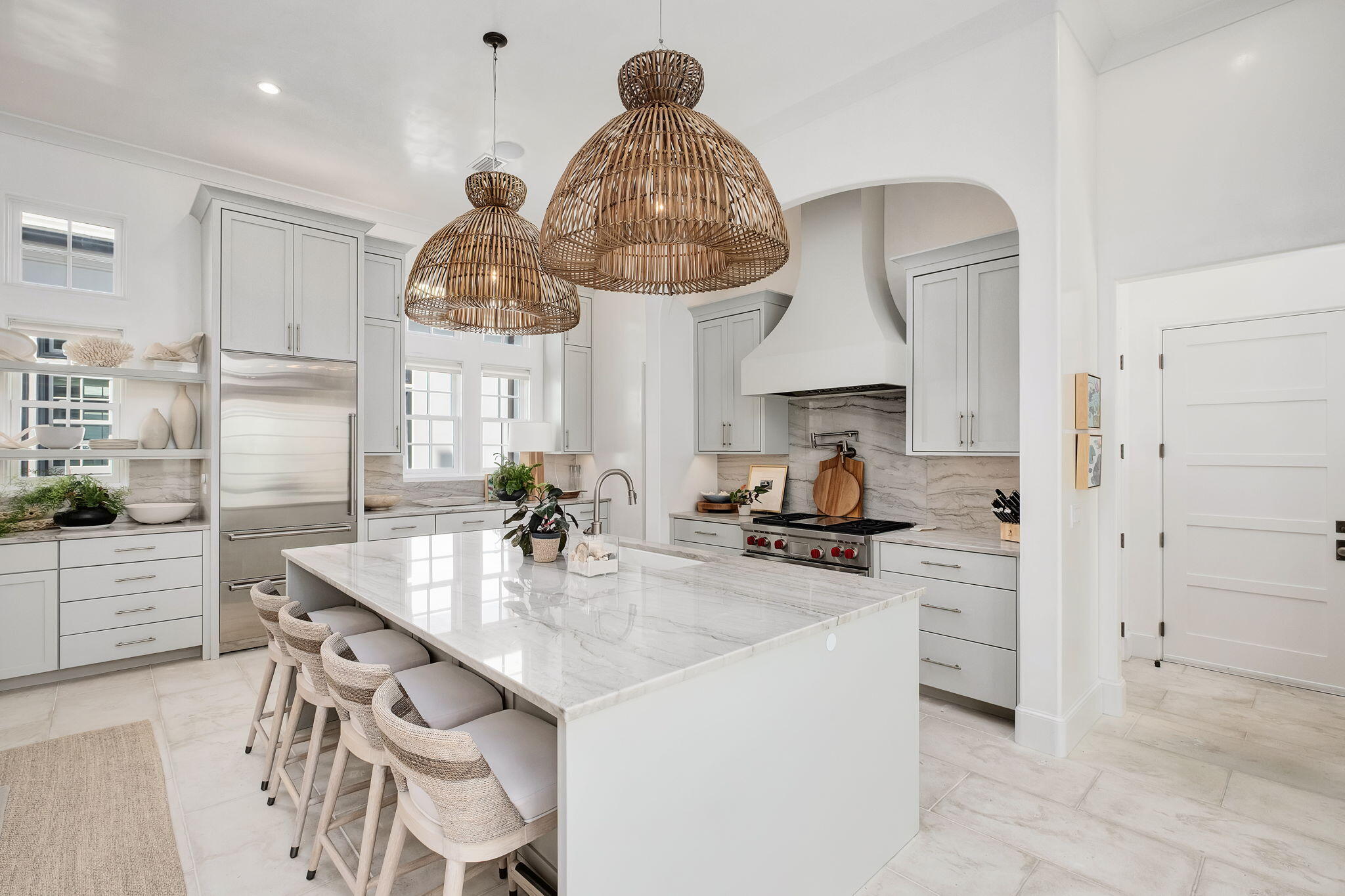 91 Whalebone Alley Inlet Beach, FL 32461 - Photo 10 of 17 a kitchen with stainless steel appliances a sink a stove and a chandelier