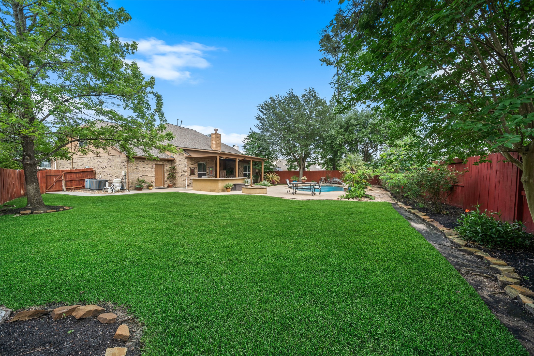 6407 Ashley Manor Drive Spring, TX 77389 - Photo 35 of 41 a front view of a house with a yard table and chairs