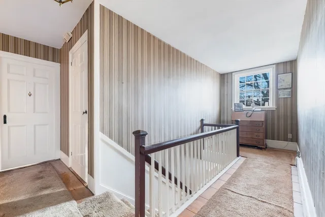 a bedroom with furniture and a flat screen tv