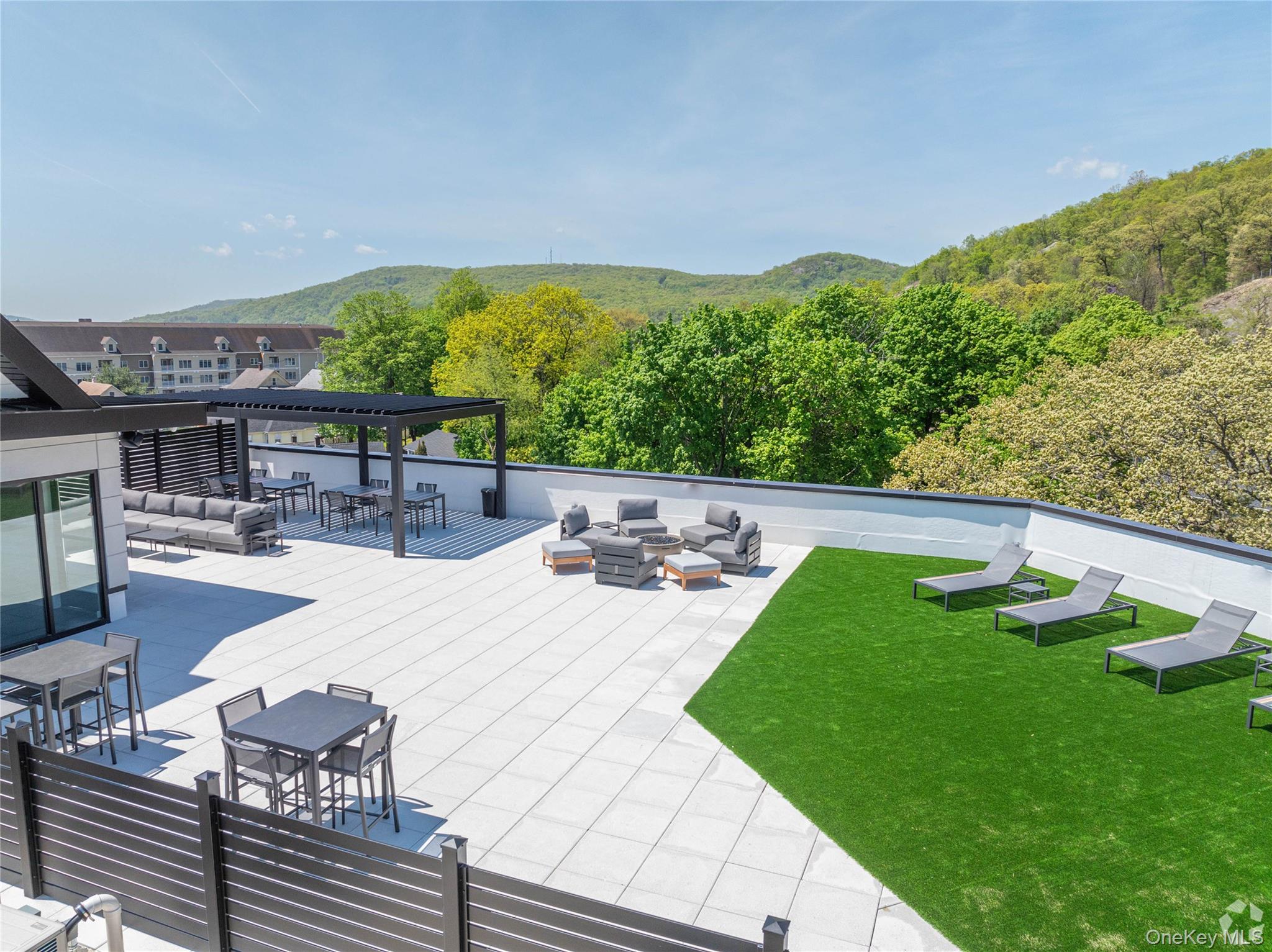 15 Washington Avenue, Unit 314 Suffern, NY 10901 - Photo 14 of 31 a view of a swimming pool with a patio