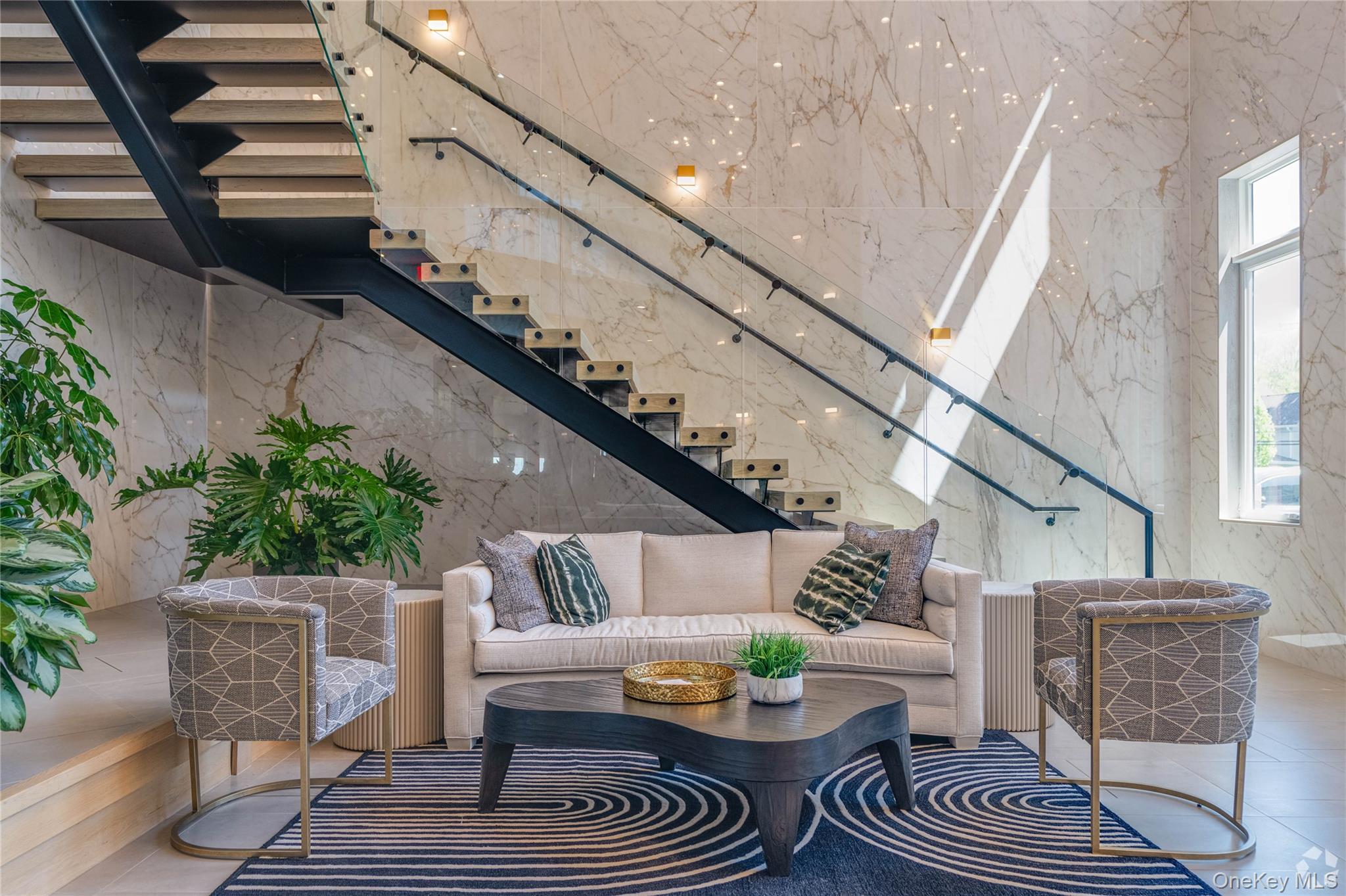 15 Washington Avenue, Unit 314 Suffern, NY 10901 - Photo 9 of 31 a living room with furniture and a rug