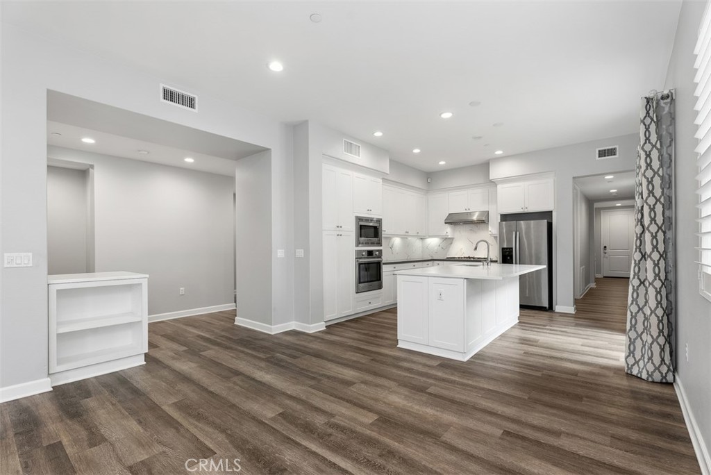 179 Follyhatch Irvine, CA 92618 - Photo 13 of 48 a view of kitchen with wooden floor