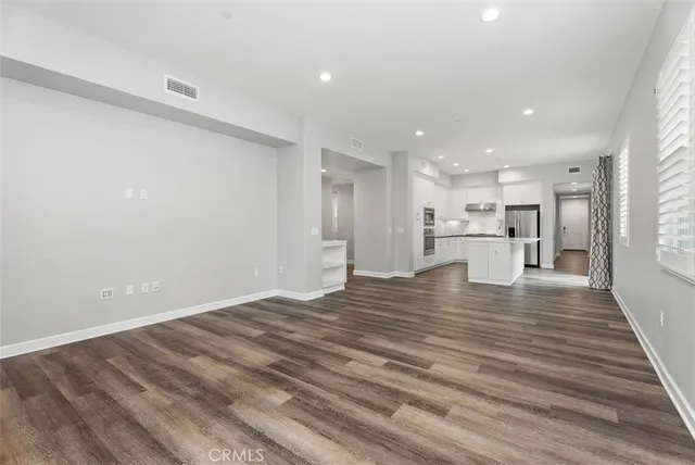 a view of kitchen with wooden floor