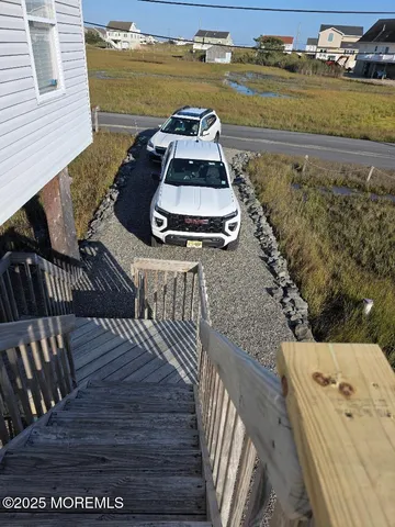 a view of a balcony with wooden floor
