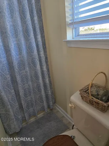 a bathroom with a sink and a window