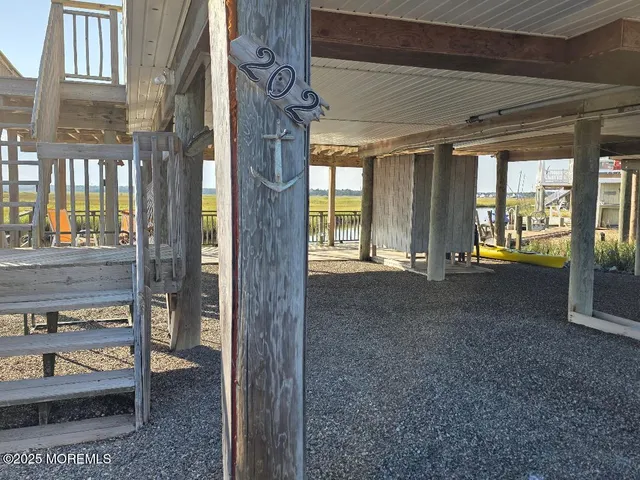 a view of an entryway with a floor to ceiling window