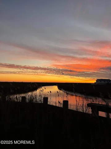 a view of a golf course with a lake