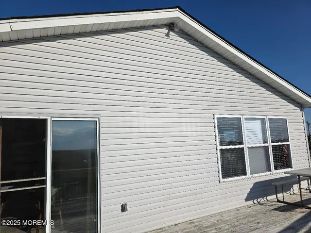 a view of backyard with windows