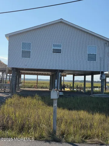 a front view of a house with lake view