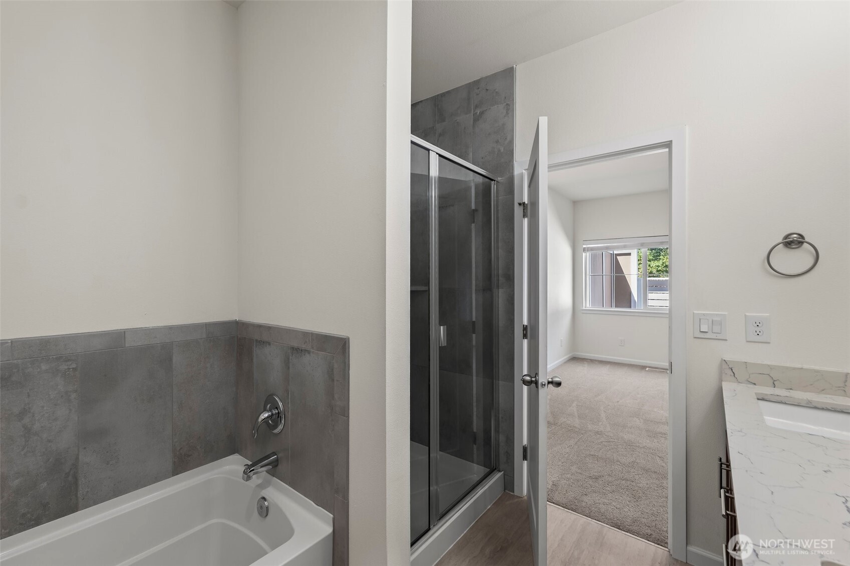 1080 East Old Ranch Road, Unit A1A2 Allyn, WA 98524 - Photo 20 of 35 a bathroom with a tub shower and sink