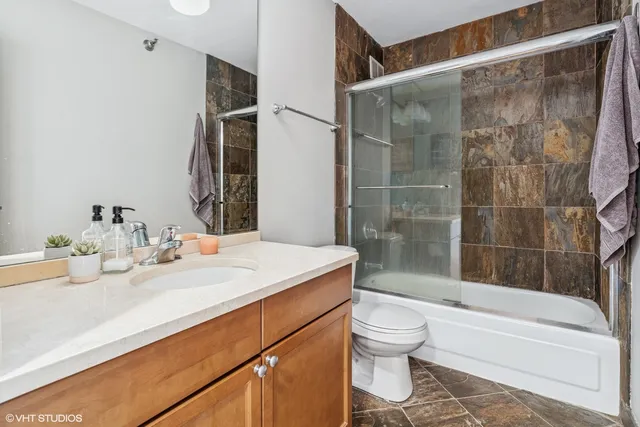 a gym room with gym equipment and a view of living room