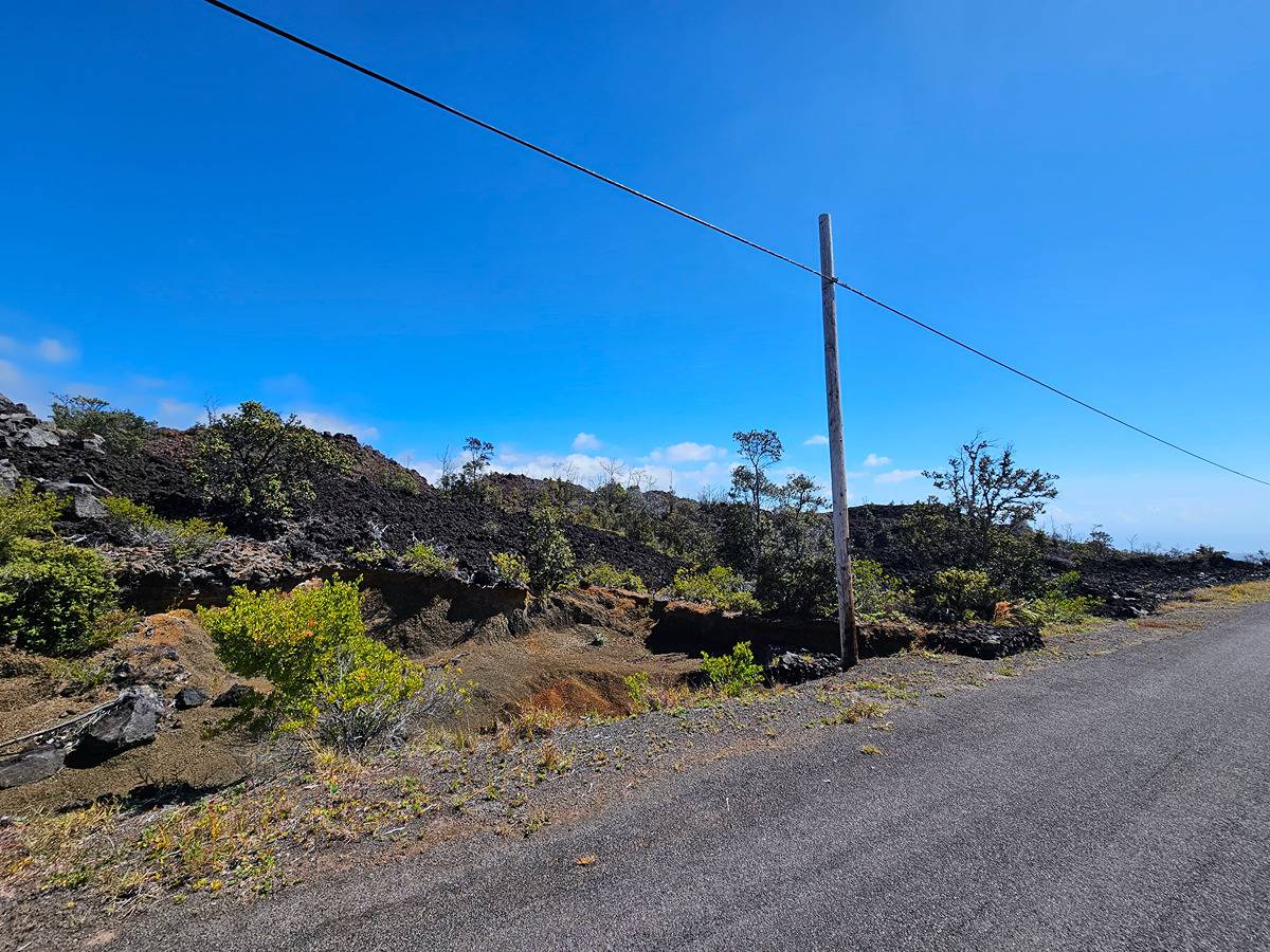 a view of a road with a building in the background