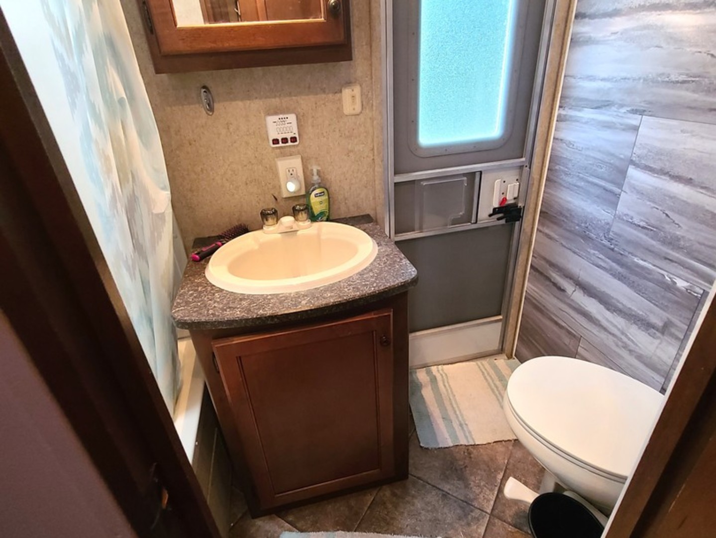 13-109 Woodhaven Sublette, IL 61367 - Photo 17 of 21 a bathroom with a sink a mirror a toilet and vanity