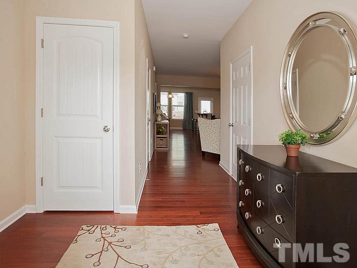 1007 Grand Ridge Drive Rolesville, NC 27571 - Photo 15 of 16 a view of a hallway with wooden floor and windows