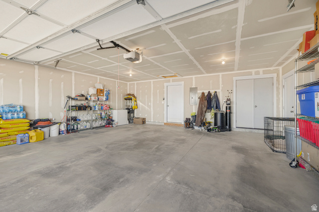 18573 South Marsh Valley Road Downey, ID 83234 - Photo 21 of 32 Garage featuring electric panel and a garage door opener