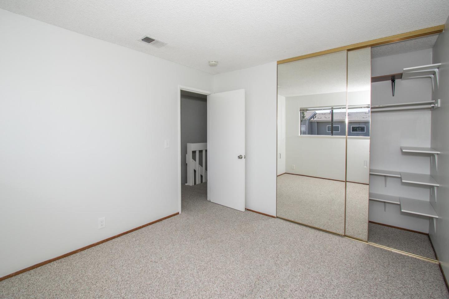 810 Juno Lane Foster City, CA 94404 - Photo 20 of 43 a view of a room with a refrigerator and cabinets