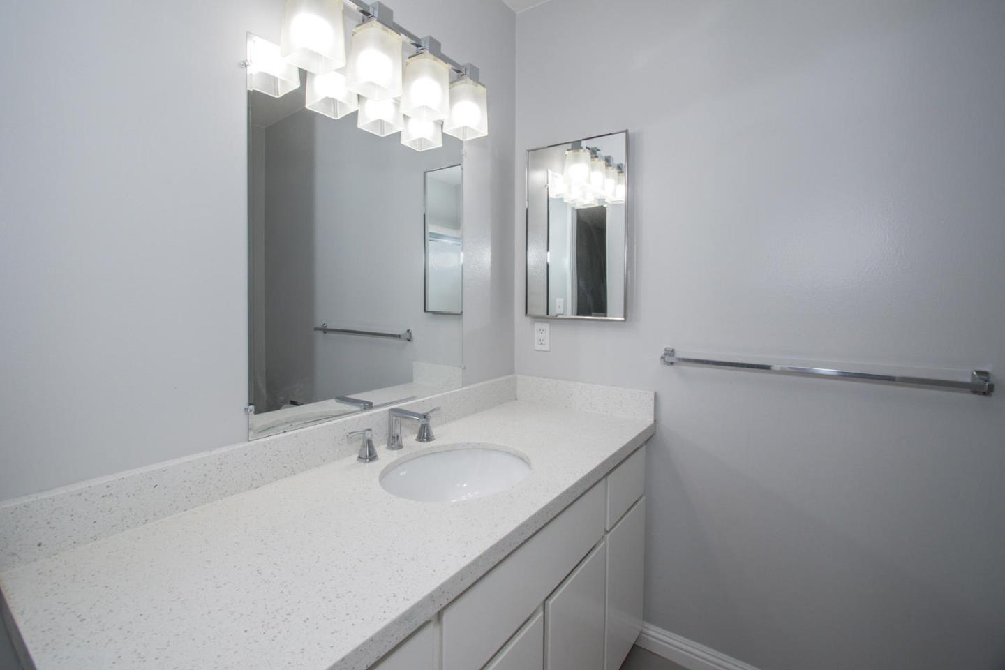 810 Juno Lane Foster City, CA 94404 - Photo 23 of 43 a bathroom with a sink and a mirror