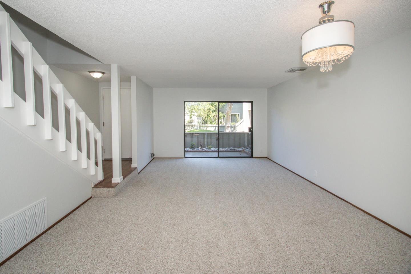 810 Juno Lane Foster City, CA 94404 - Photo 9 of 43 a view of a livingroom with a chandelier