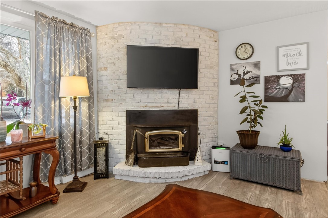 4600 Ontario Center Road Walworth, NY 14568 - Photo 12 of 48 Curved Stone Wall with Woodstove