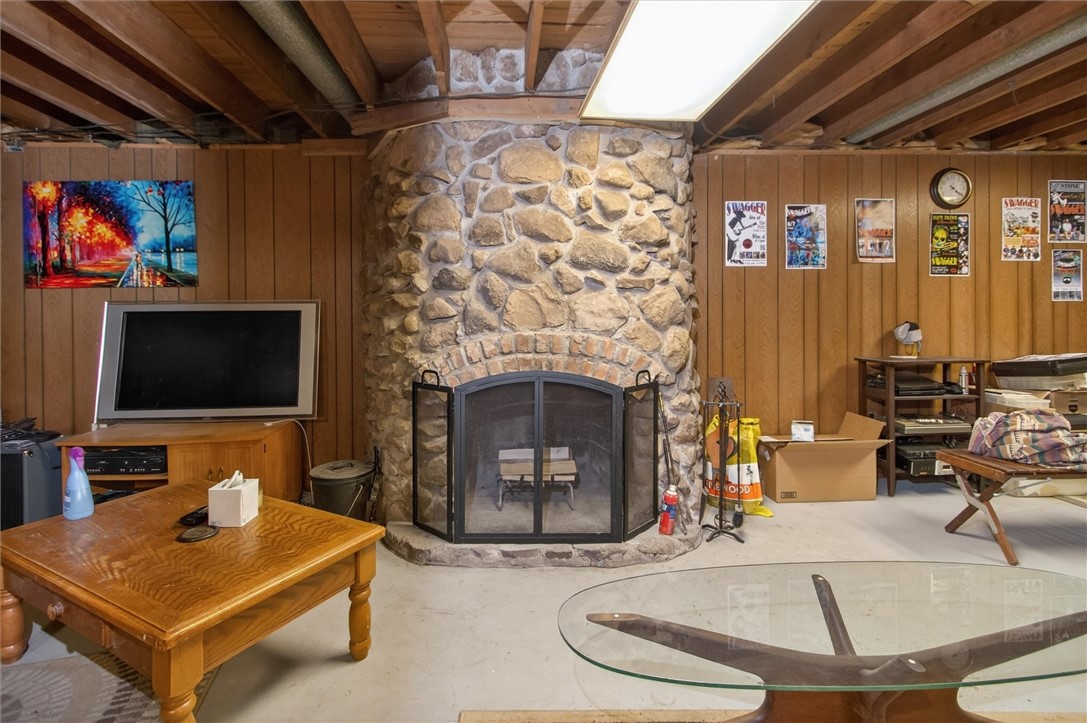 4600 Ontario Center Road Walworth, NY 14568 - Photo 37 of 48 Stone Fireplace in basement livingroom