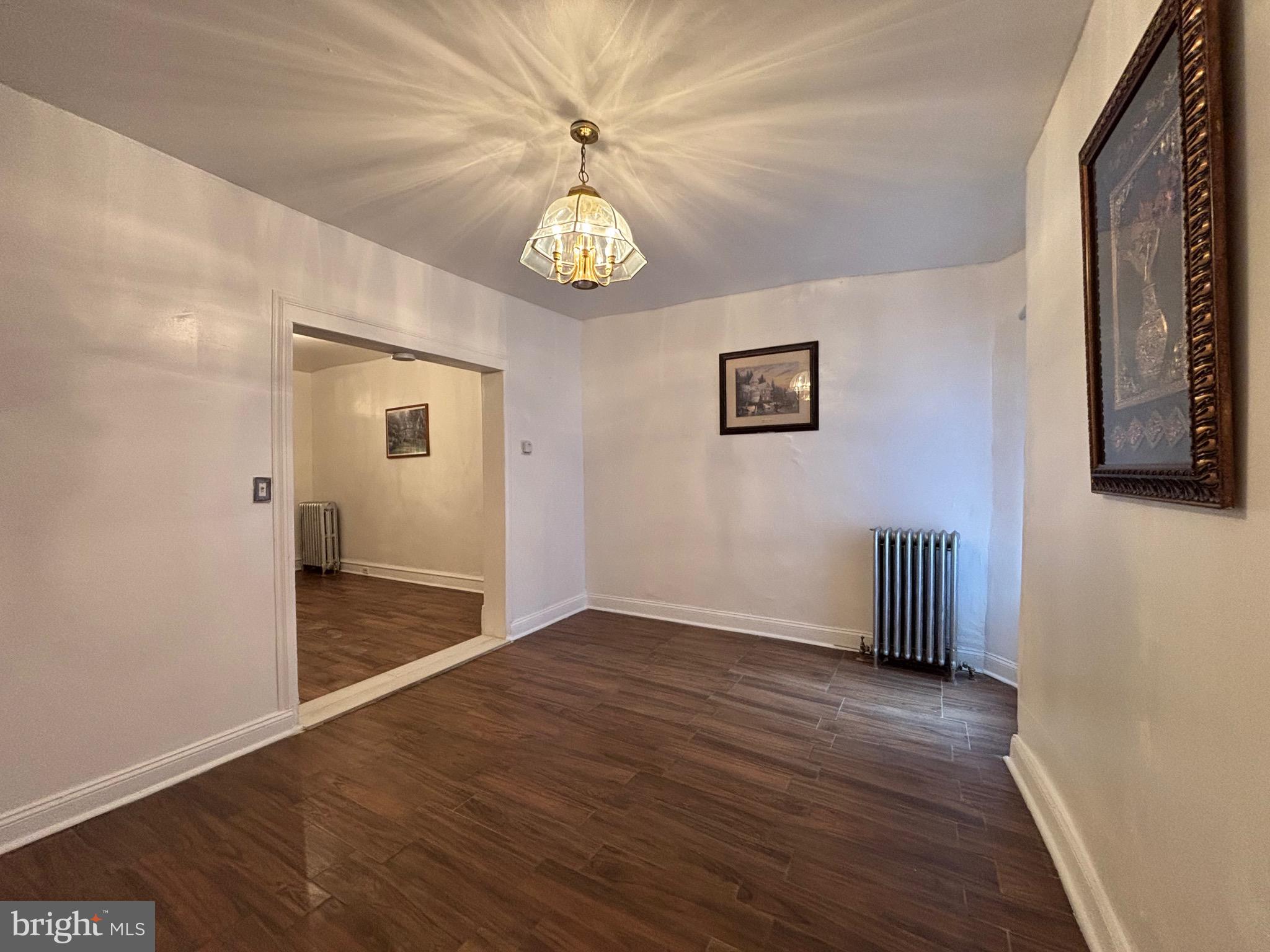 3219 North 29th Street Philadelphia, PA 19129 - Photo 12 of 48 an empty room with wooden floor and windows