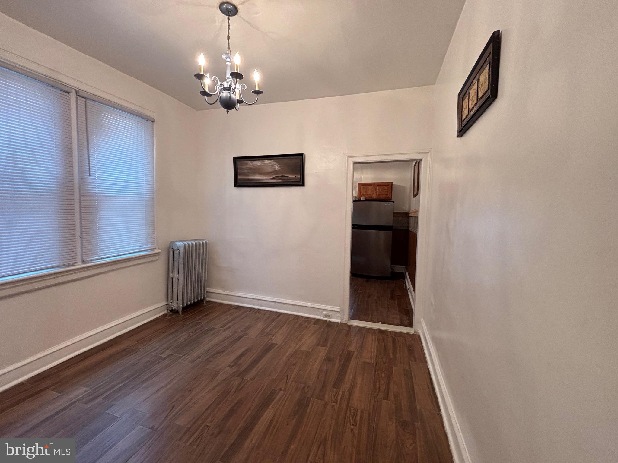 3219 North 29th Street Philadelphia, PA 19129 - Photo 14 of 48 a view of livingroom with hallway and wooden floor