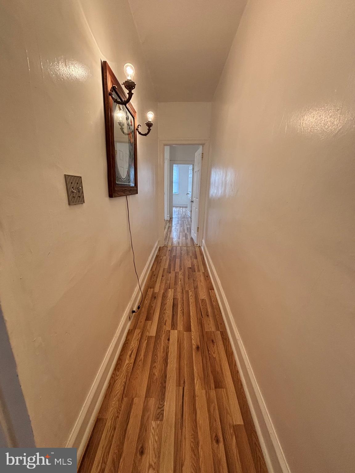 3219 North 29th Street Philadelphia, PA 19129 - Photo 22 of 48 a view of a hallway with wooden floor and staircase