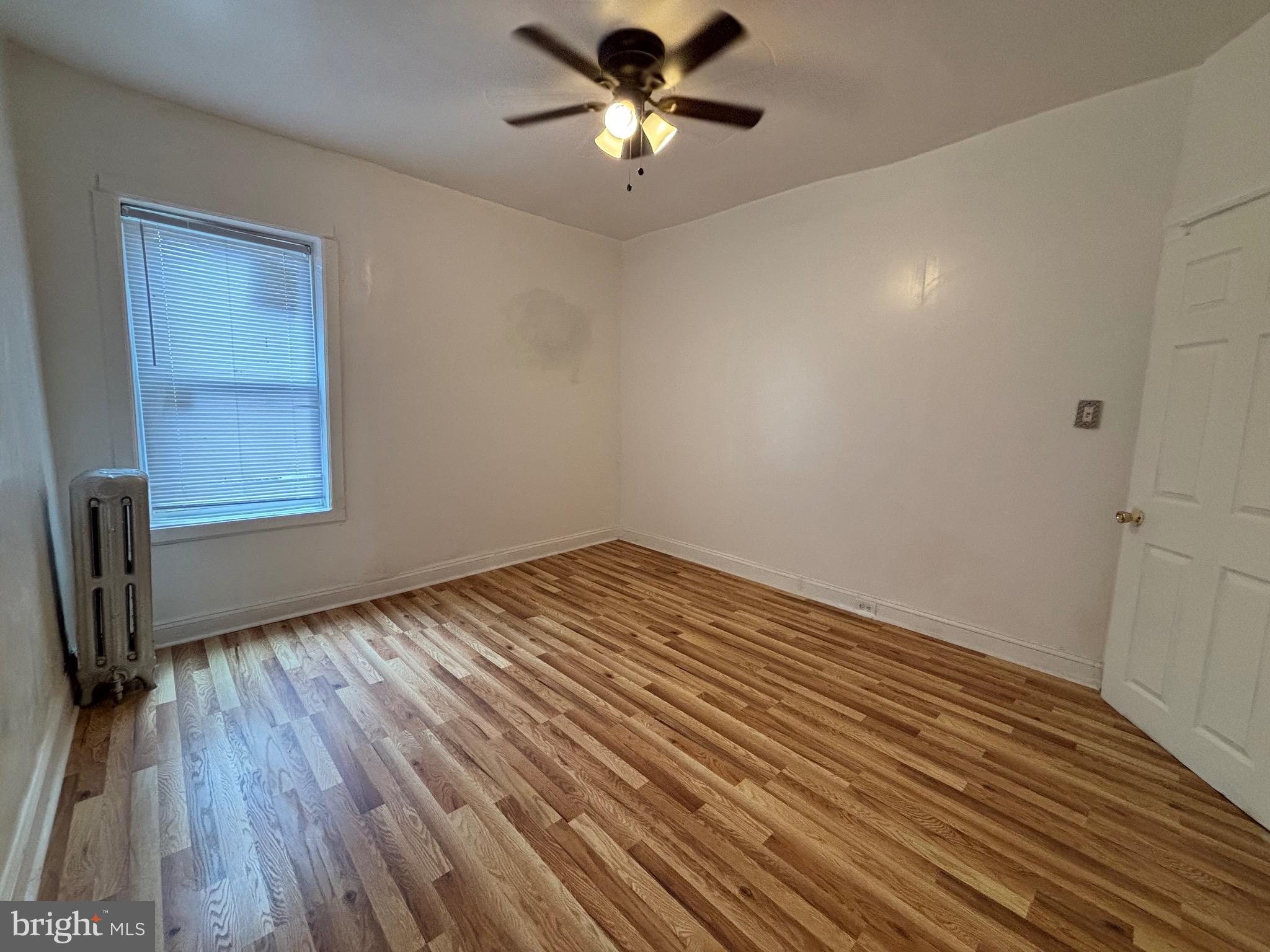 3219 North 29th Street Philadelphia, PA 19129 - Photo 28 of 48 a view of empty room with wooden floor and fan