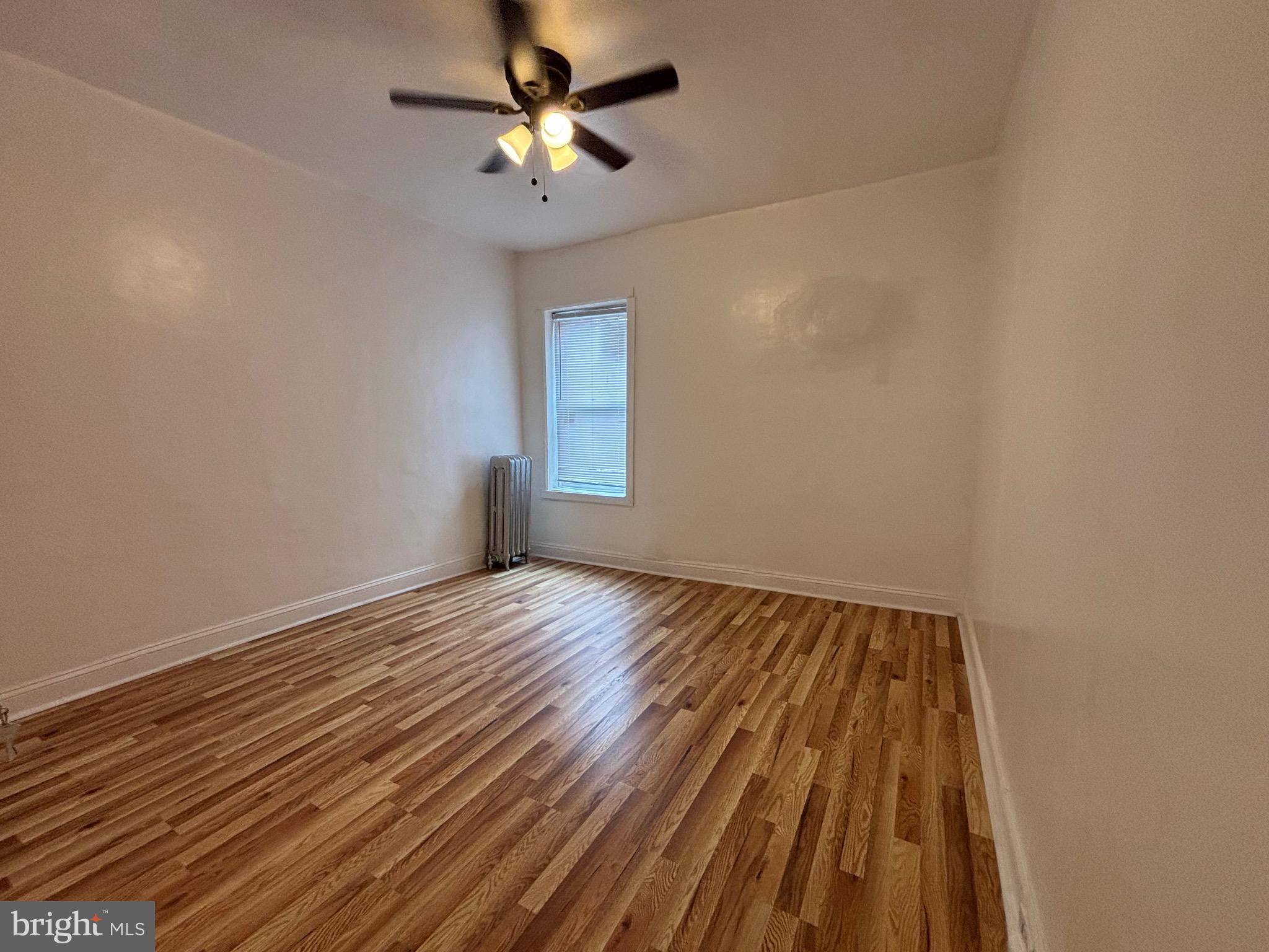 3219 North 29th Street Philadelphia, PA 19129 - Photo 32 of 48 wooden floor in an empty room with a window