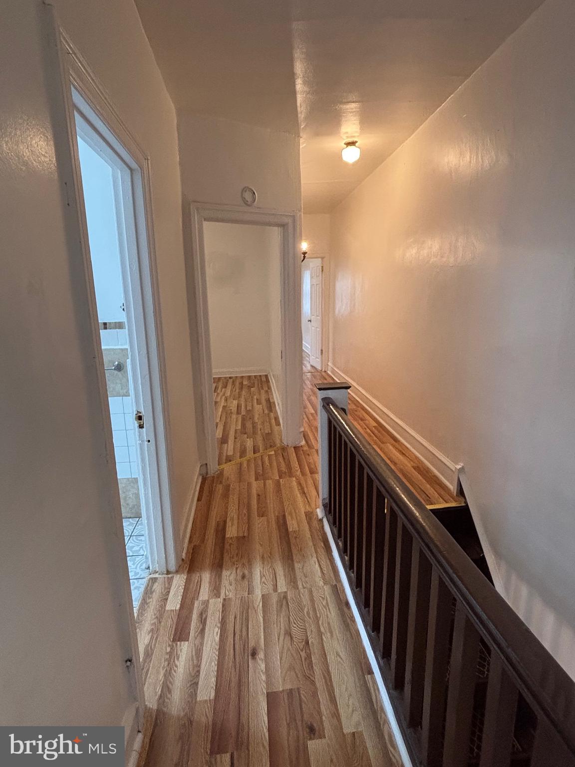 3219 North 29th Street Philadelphia, PA 19129 - Photo 33 of 48 a view of a hallway with wooden floor and stairs