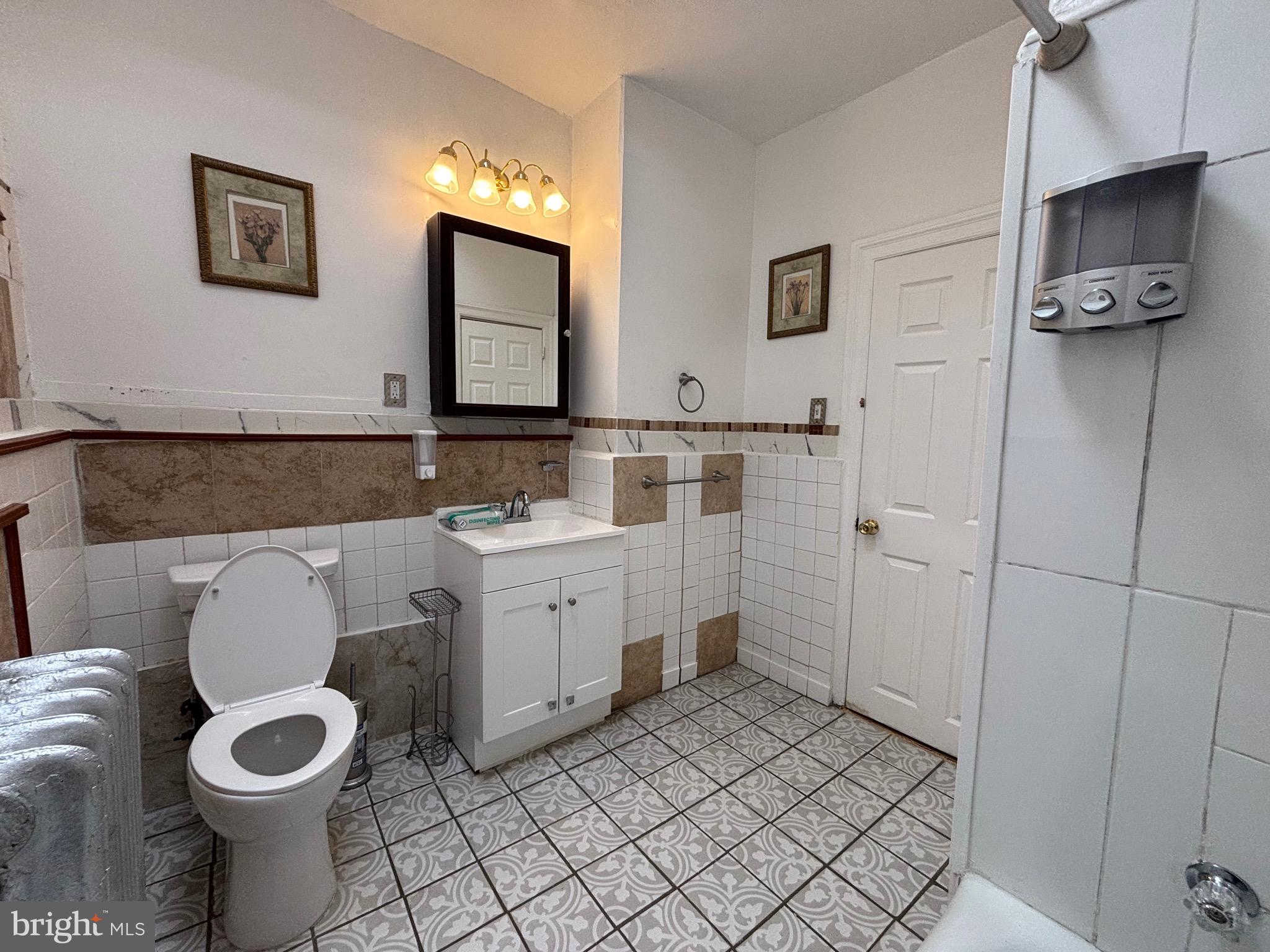 3219 North 29th Street Philadelphia, PA 19129 - Photo 34 of 48 a bathroom with a toilet sink and mirror