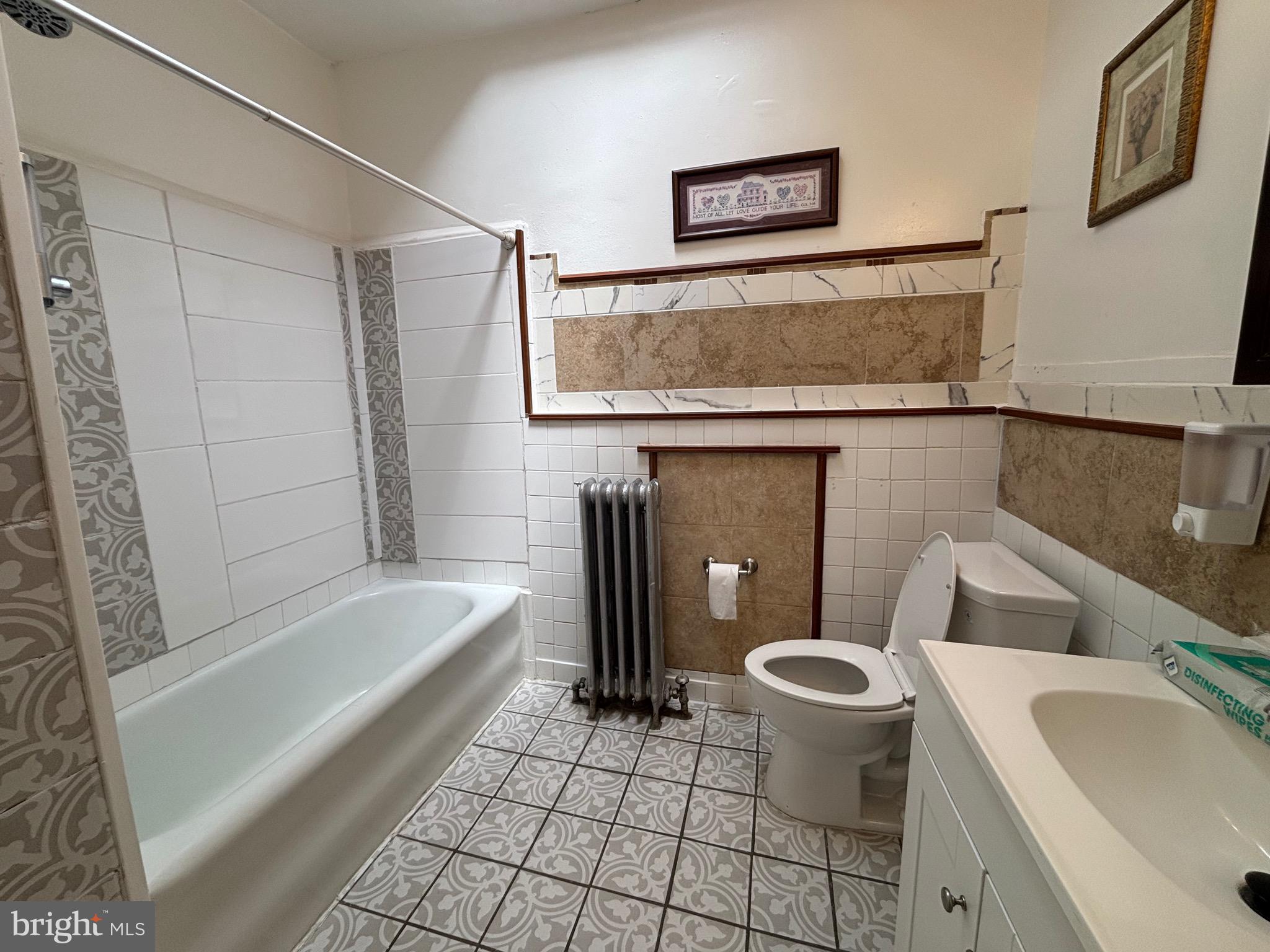 3219 North 29th Street Philadelphia, PA 19129 - Photo 35 of 48 a bathroom with a sink a toilet and bathtub