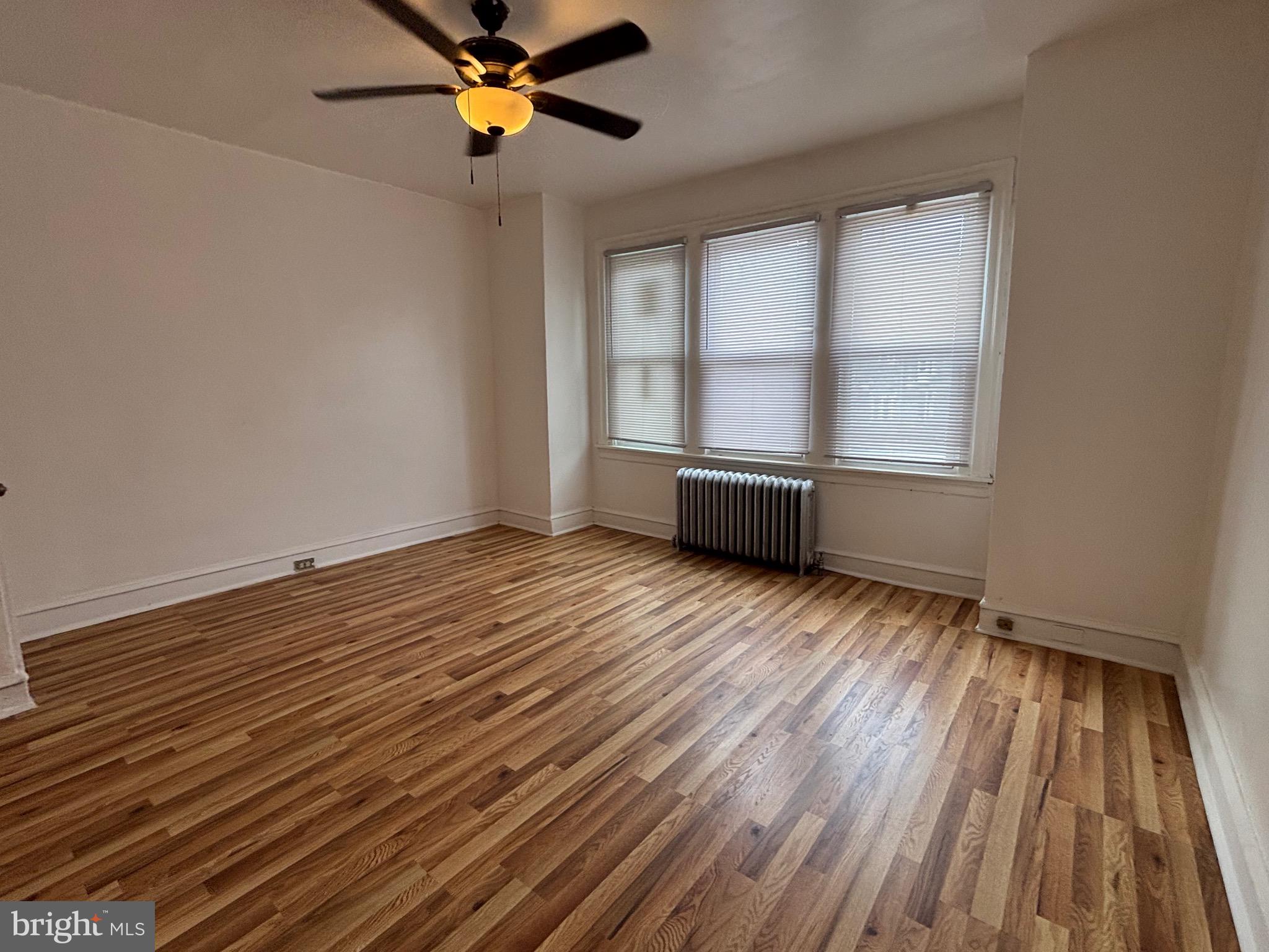 3219 North 29th Street Philadelphia, PA 19129 - Photo 39 of 48 wooden floor in an empty room with a window