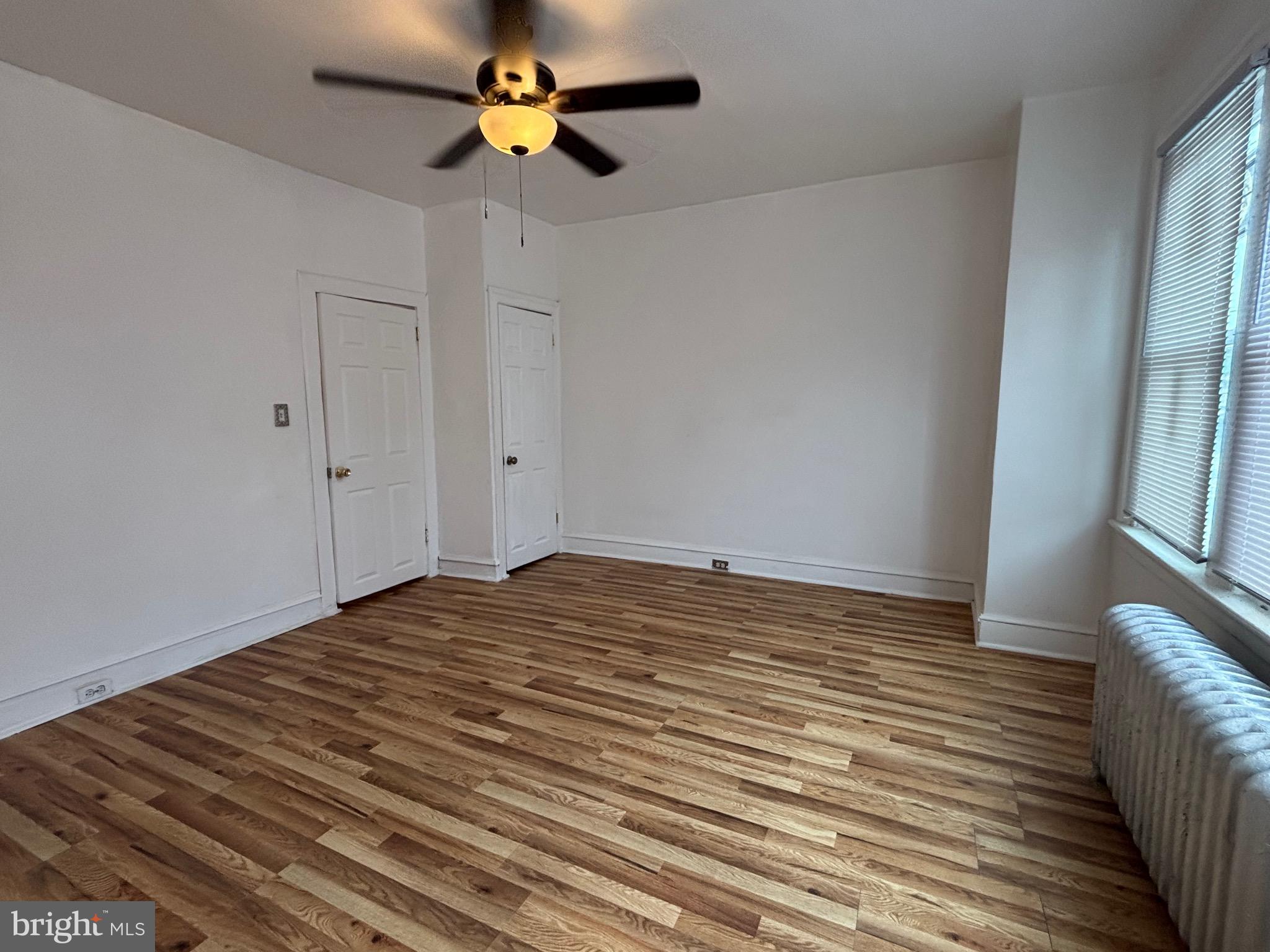 3219 North 29th Street Philadelphia, PA 19129 - Photo 40 of 48 a view of empty room with wooden floor and fan