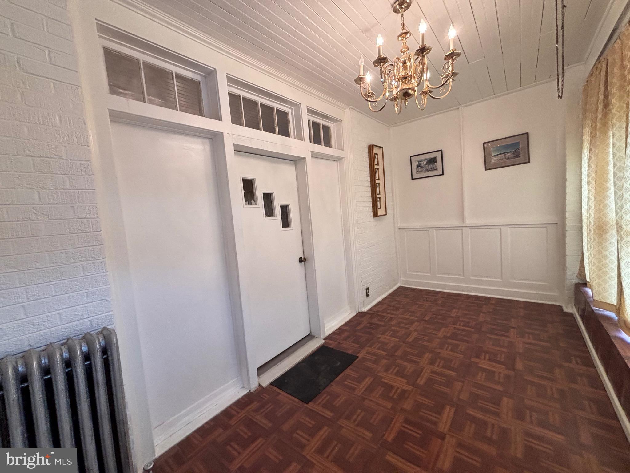 3219 North 29th Street Philadelphia, PA 19129 - Photo 6 of 48 a view of a hallway with windows and chandelier