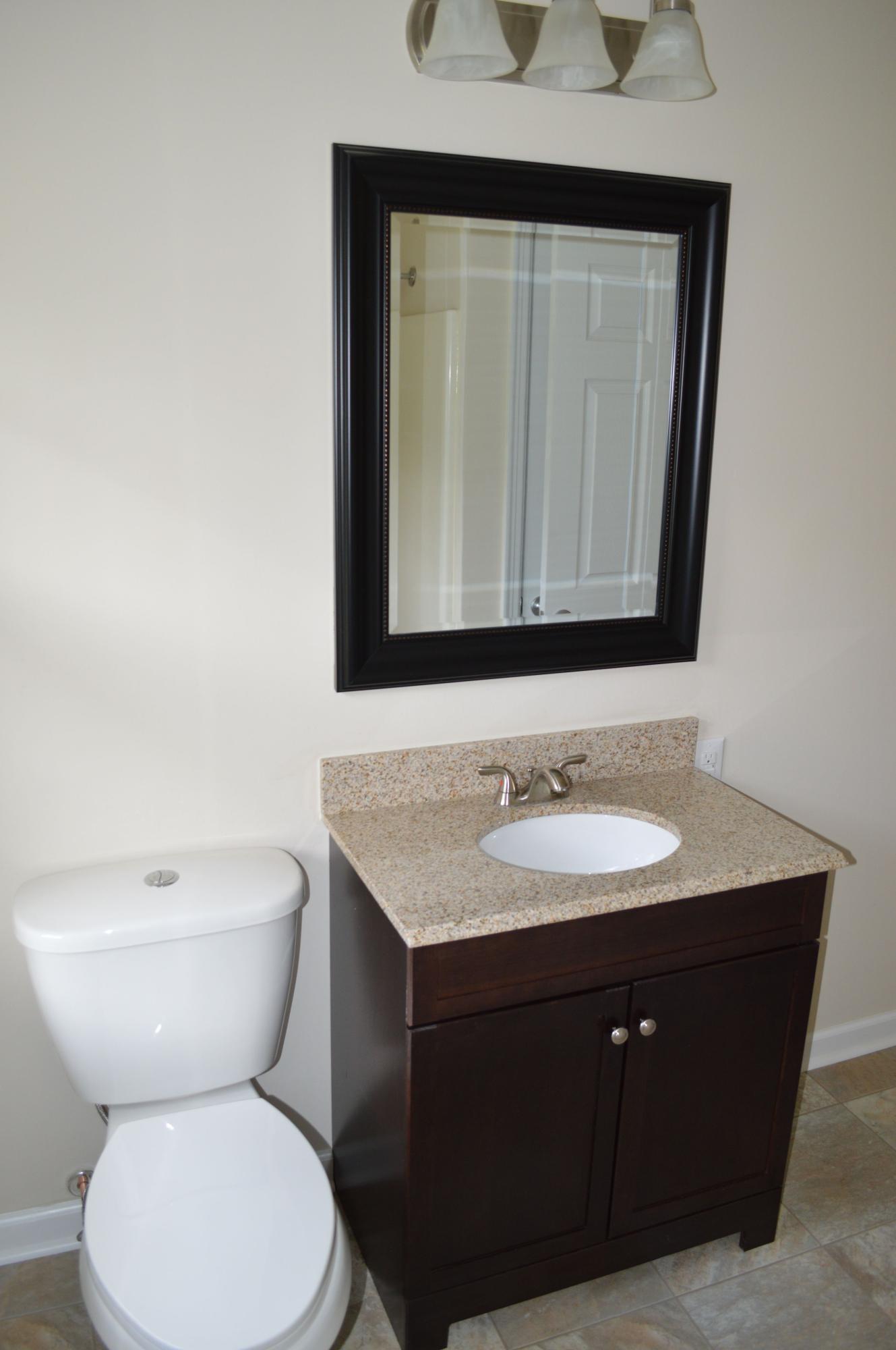 520 Olney Road Vinton, VA 24179 - Photo 11 of 29 a bathroom with a toilet sink and mirror
