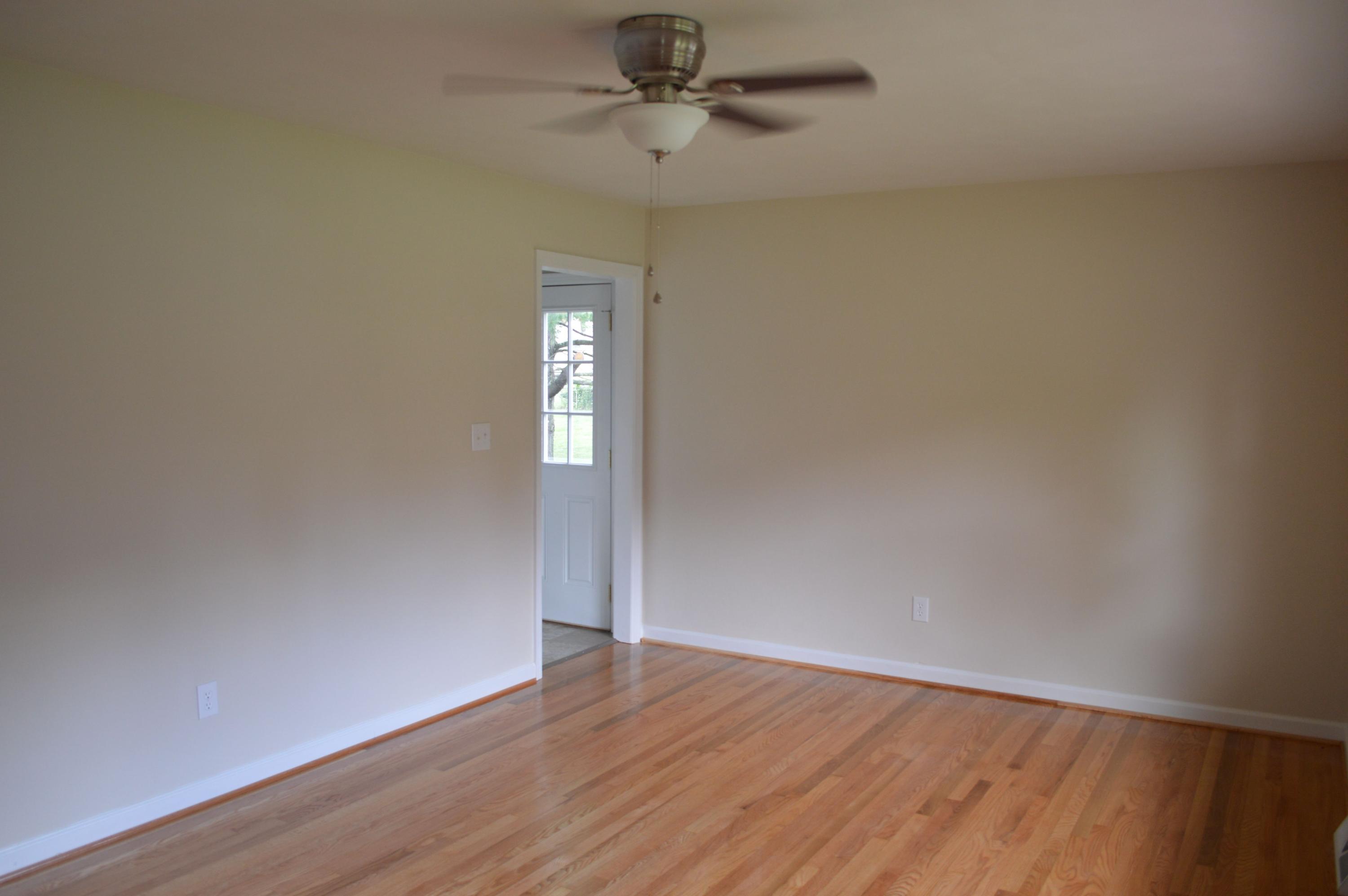 520 Olney Road Vinton, VA 24179 - Photo 20 of 29 a view of an empty room with wooden floor and a window