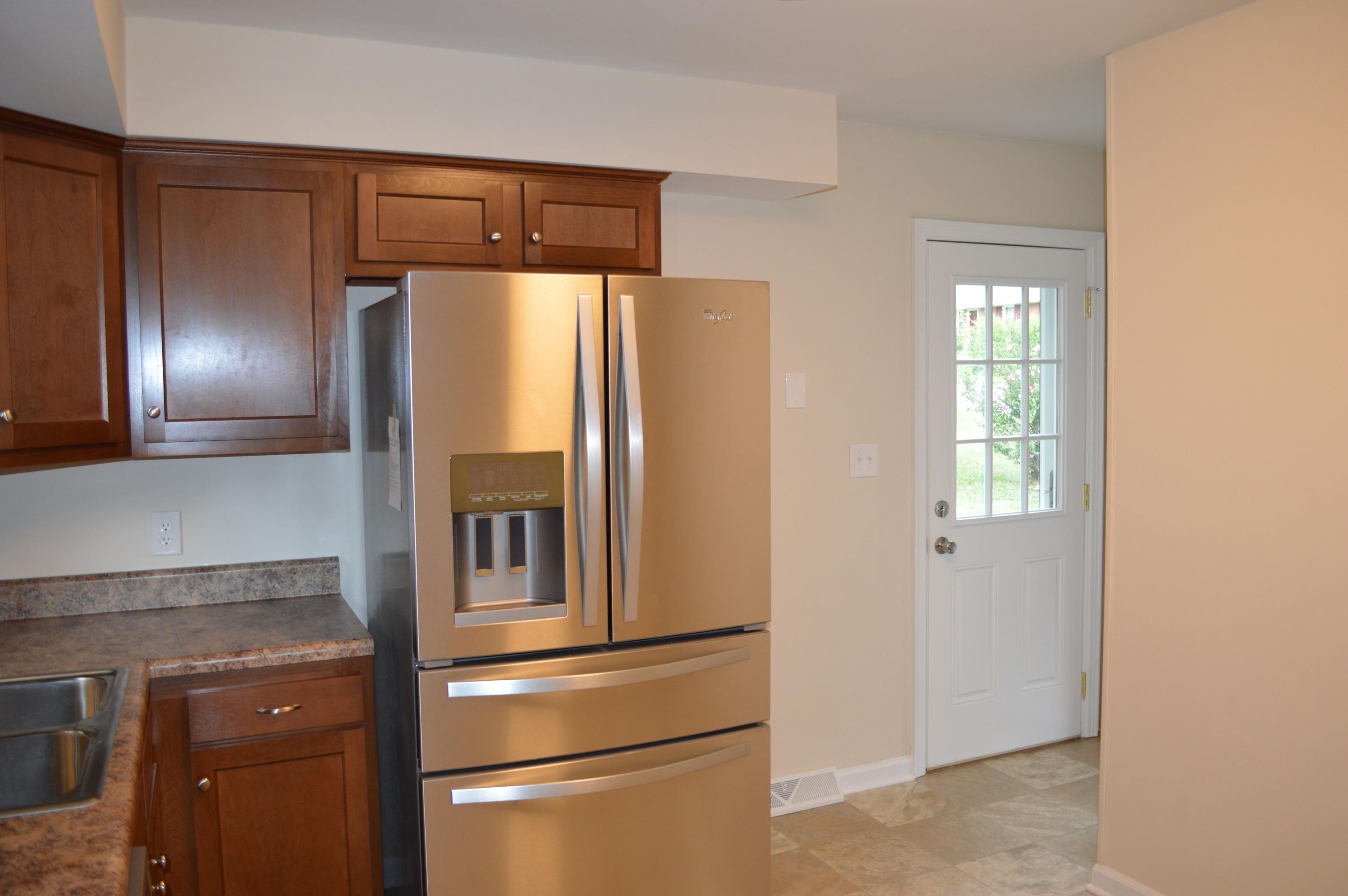 520 Olney Road Vinton, VA 24179 - Photo 5 of 29 a metallic refrigerator freezer sitting in a kitchen