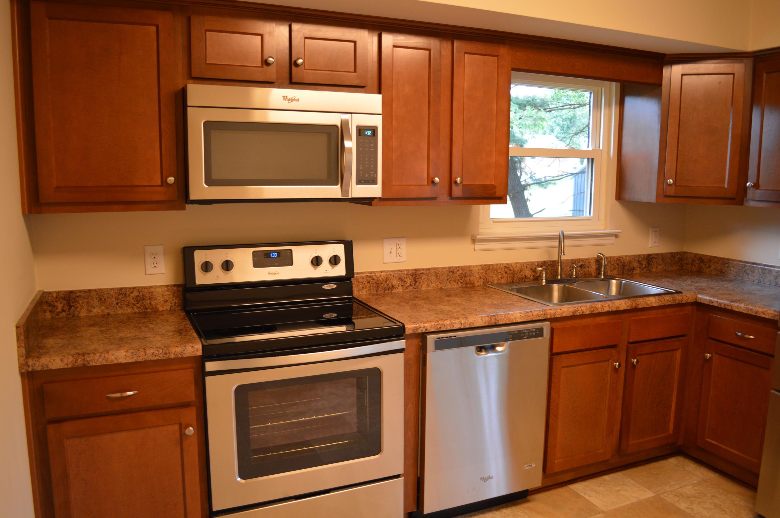 520 Olney Road Vinton, VA 24179 - Photo 6 of 29 a kitchen with granite countertop a stove sink and cabinets