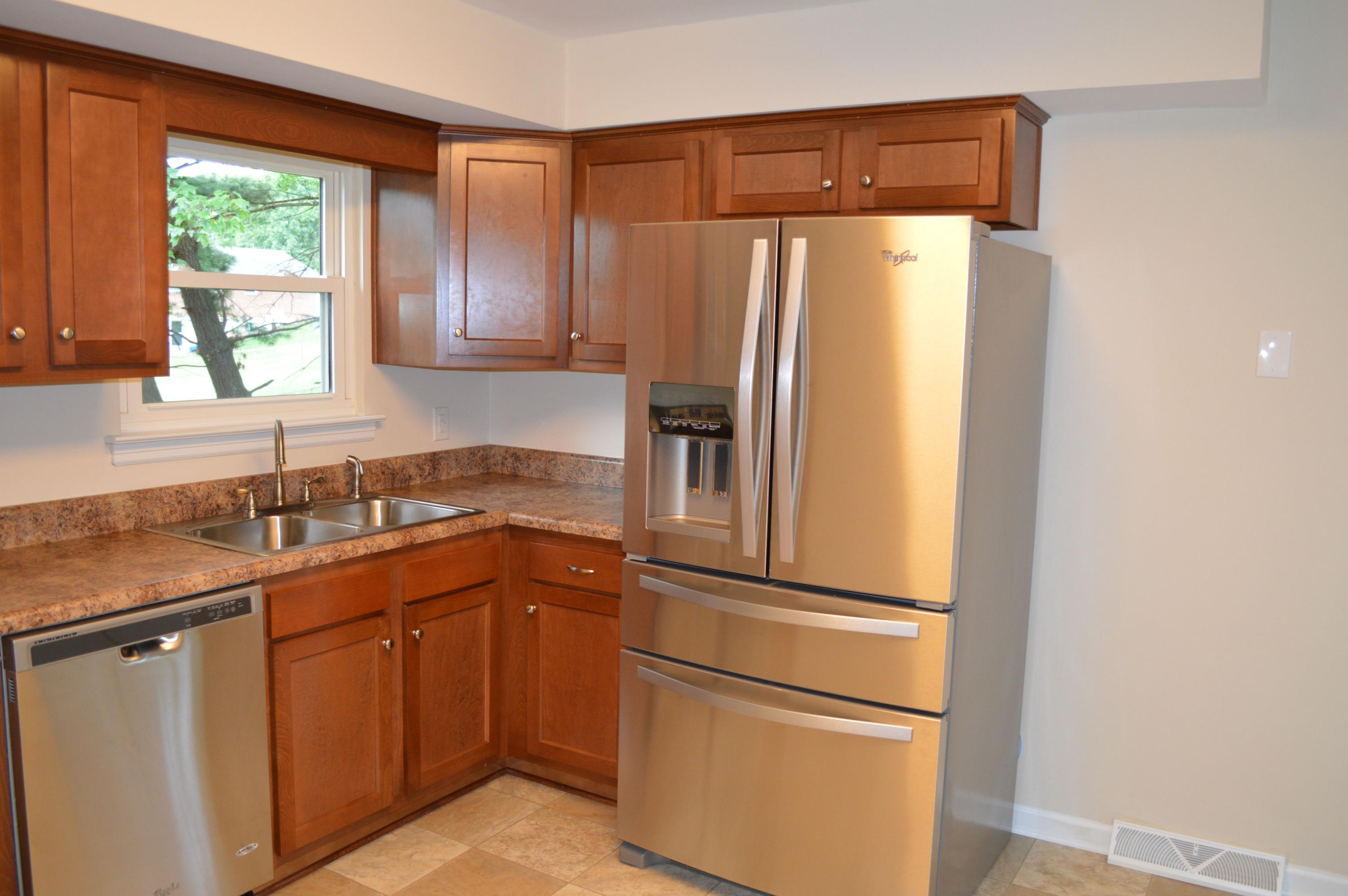 520 Olney Road Vinton, VA 24179 - Photo 7 of 29 a kitchen with appliances a refrigerator a sink and a window
